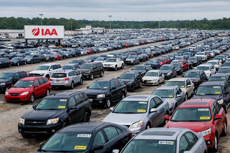 IAA auto auction yard with rows of vehicles sold through online auctions