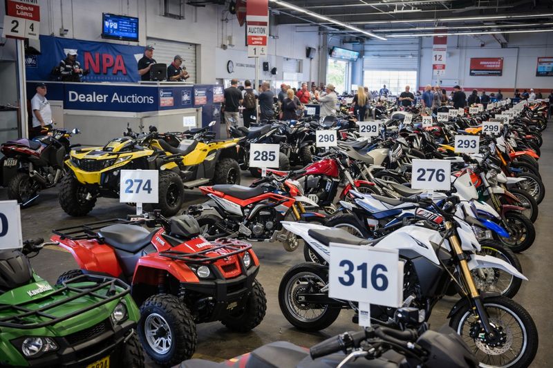 Powersports vehicles lined up at a National Powersport Auctions wholesale auction